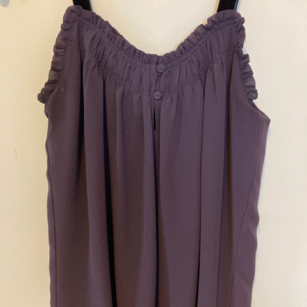 Purple tank top with black velvet straps.